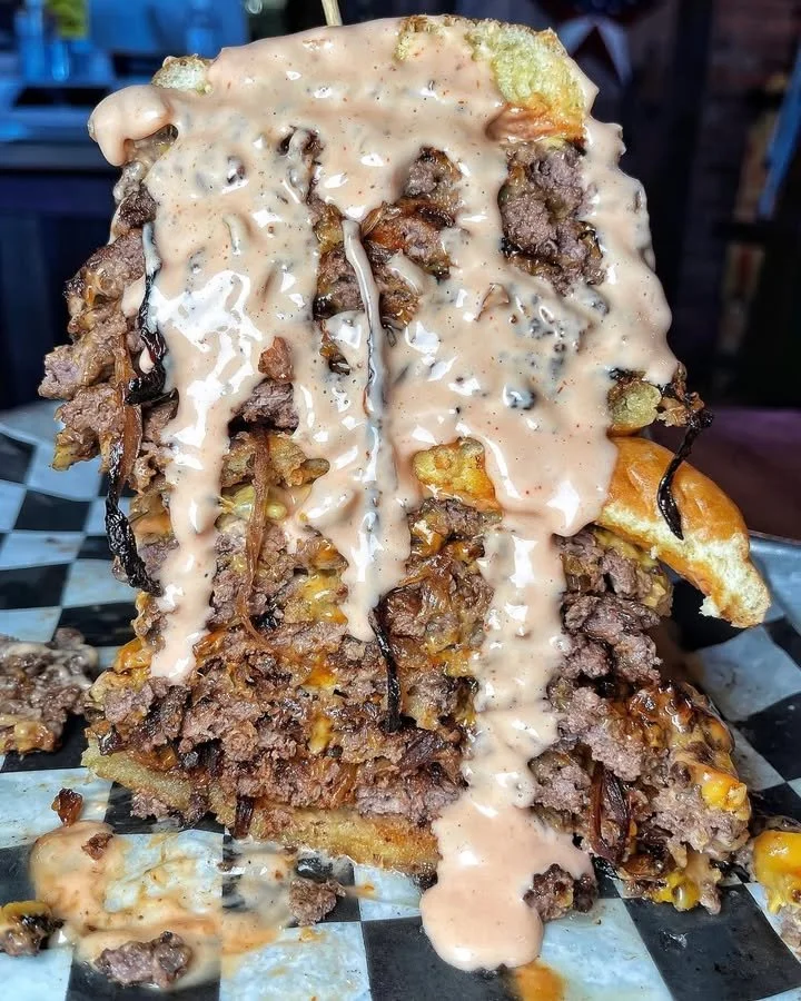 A delicious, juicy burger showcasing its fresh ingredients and mouthwatering flavor.