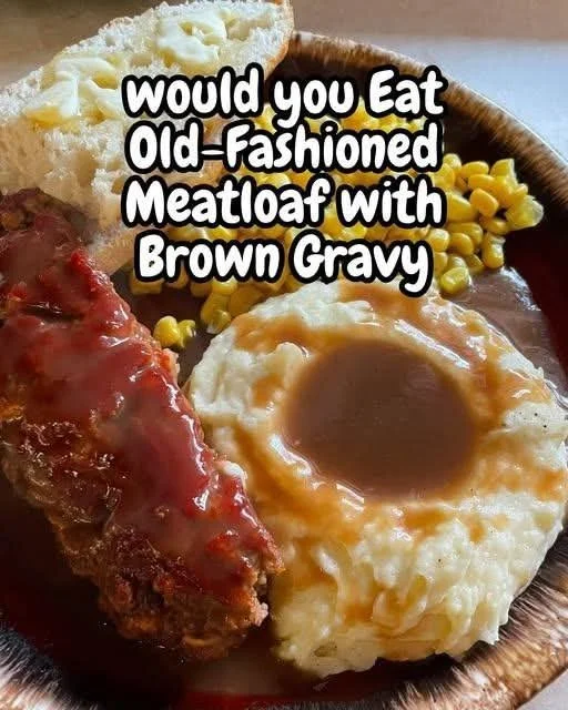 Delicious old-fashioned meatloaf served with brown gravy on a plate.