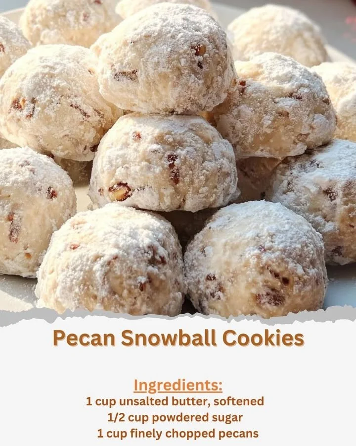 Delicious Pecan Snowball Cookies dusted with powdered sugar on a plate.
