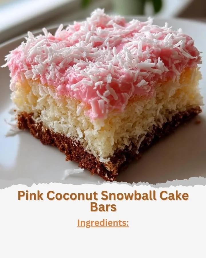 Pink Coconut Snowball Cake Bars topped with shredded coconut on a white plate