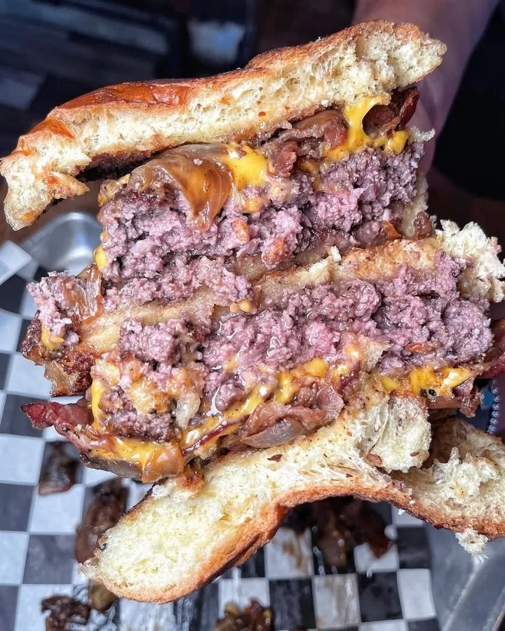 Friend saying they're not that hungry while eating half a burger