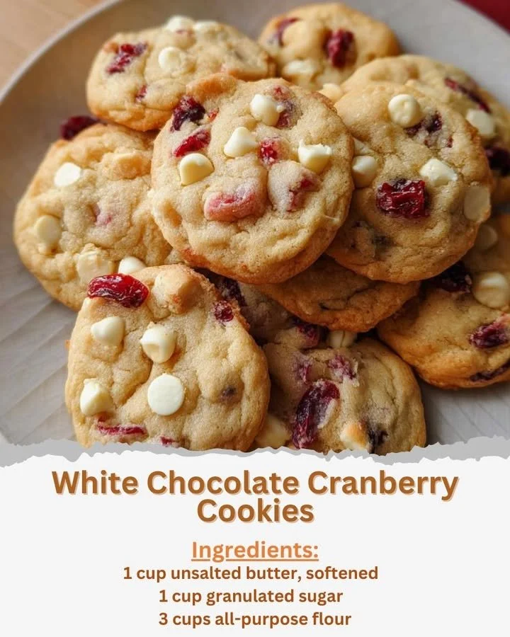 Delicious freshly baked white chocolate cranberry cookies on a wooden tray